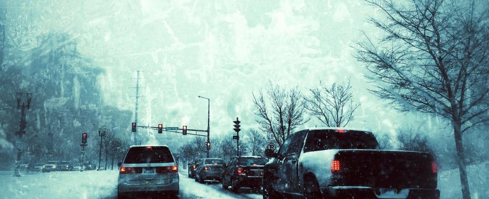 Cars, during the winter, waiting at traffic lights